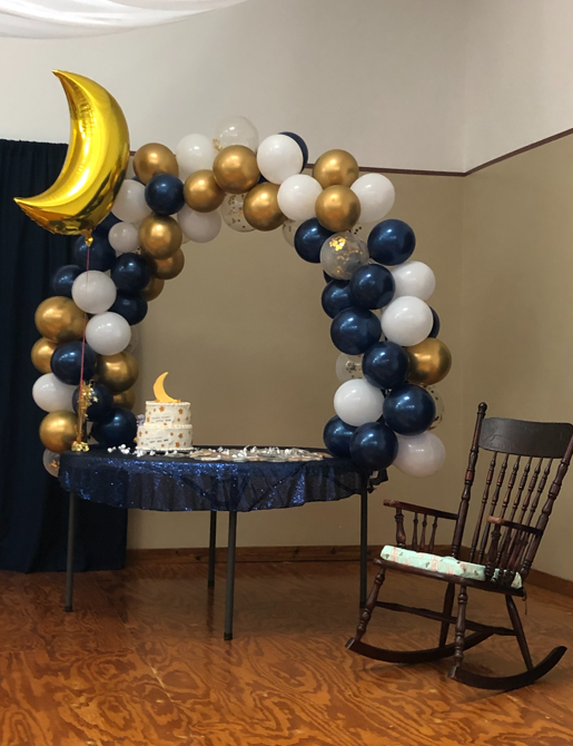 balloon archway on table